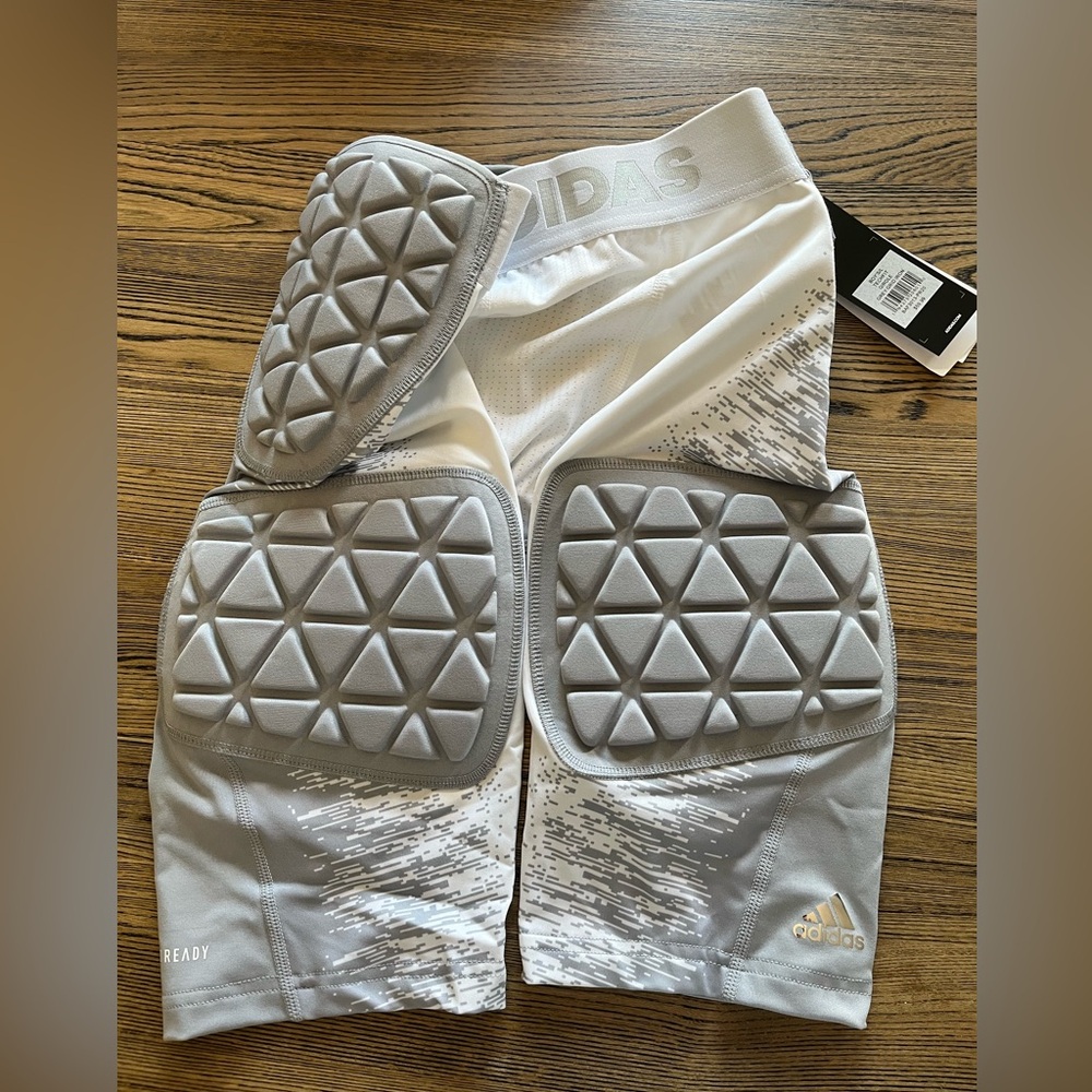 Adidas youth padded football shorts/girdle.  Size youth L